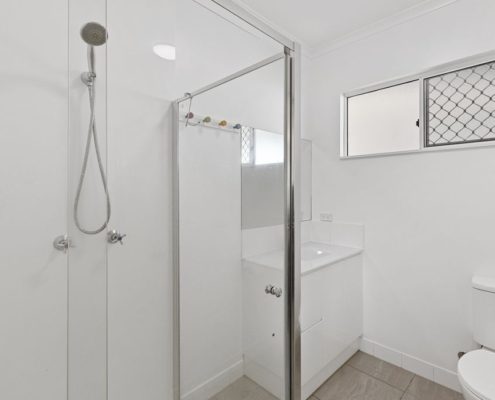 Bathroom showing shower head sink and toilet